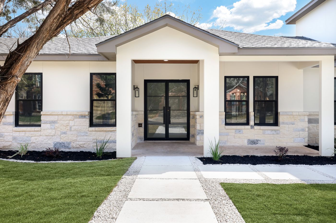 Custom entry door with floor-to-ceiling windows